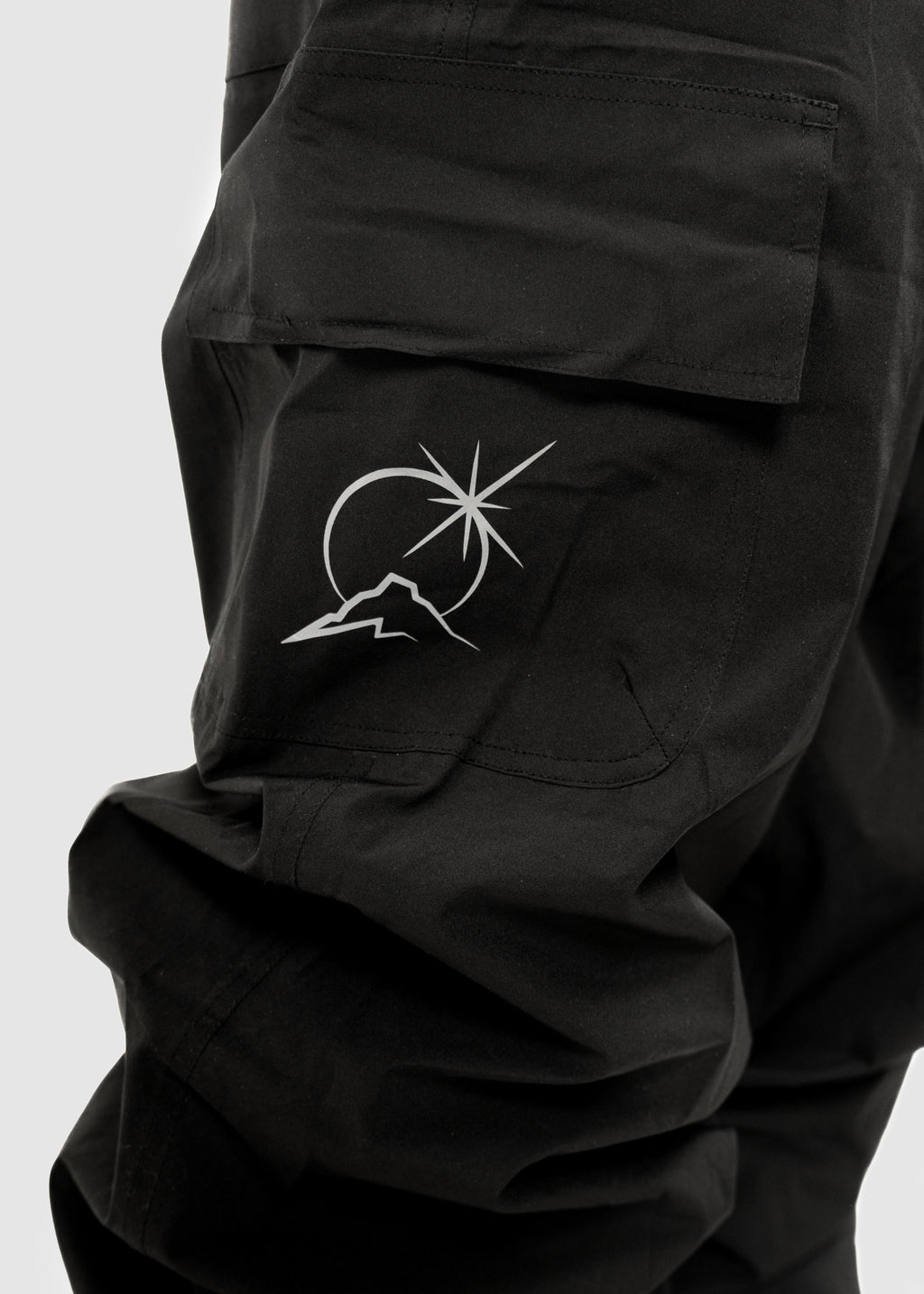 Person wearing Polar Pursuit snowpants with a white background