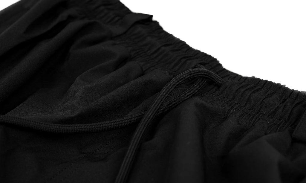 Close-up of black Polar Pursuit snowpants with a focus on the waistband.