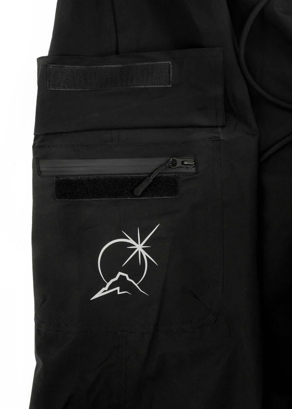 Black Polar Pursuit snowpants with a white Polar Pursuit logo on a white background
