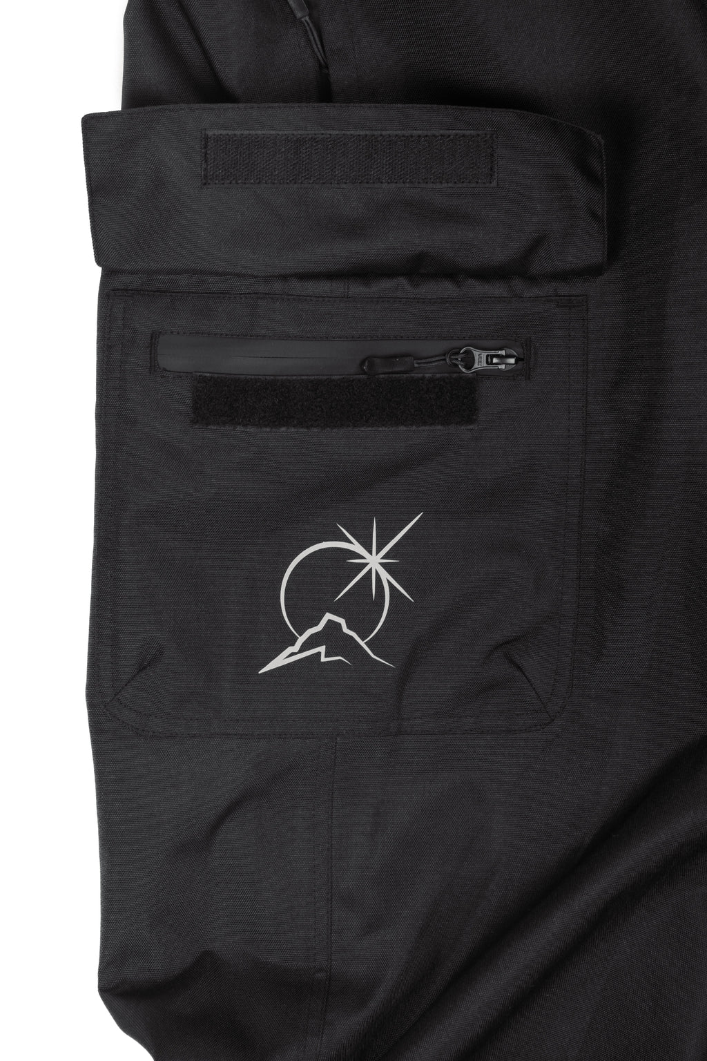 Black Polar Pursuit snowpants with a logo on the chest pocket against a white background