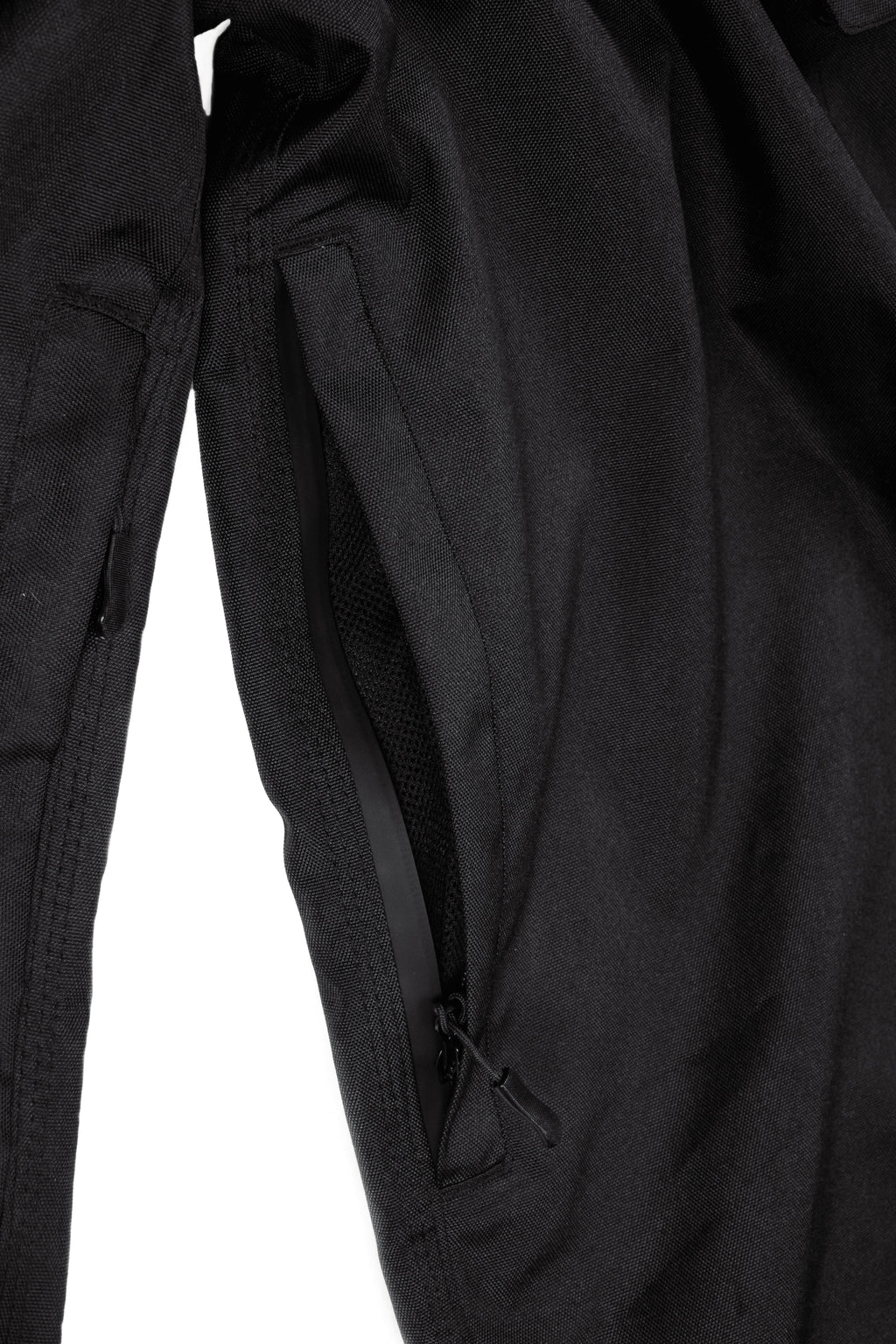 Close-up of black Polar Pursuit pants on a white background