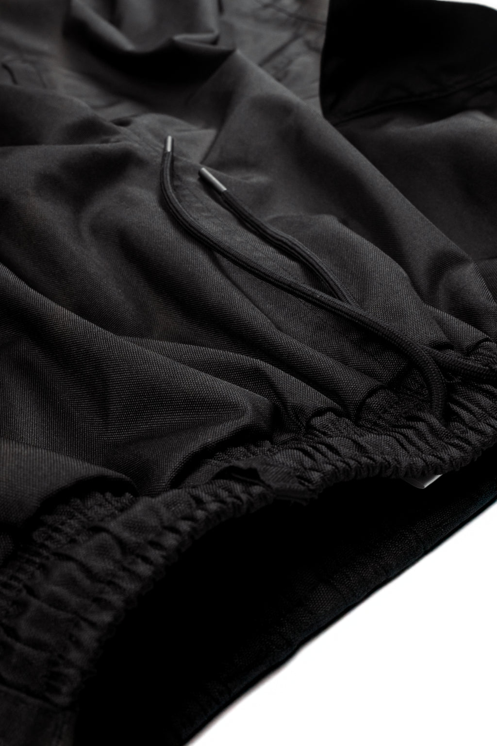 Close-up of black Polar Pursuit fabric on a white background